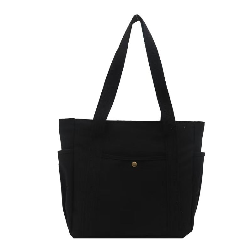 Tote bag i canvas med ytterfack Svart
